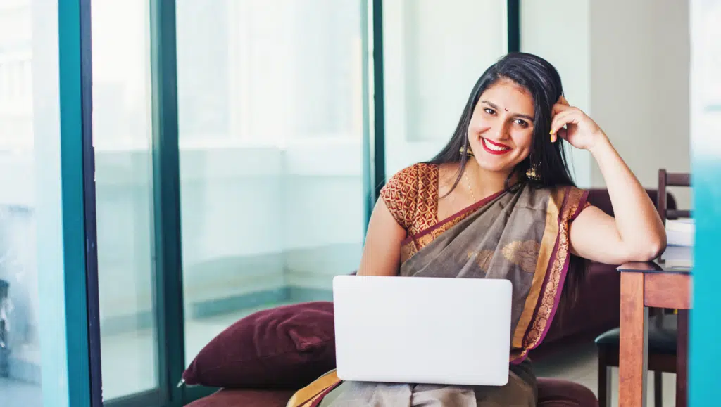 Person learning spoken English classes online on a tablet at home