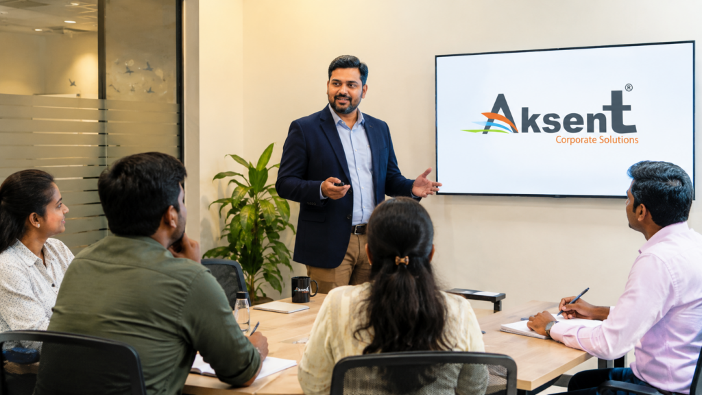 Trainer conducting an English communication session for learners at Aksent